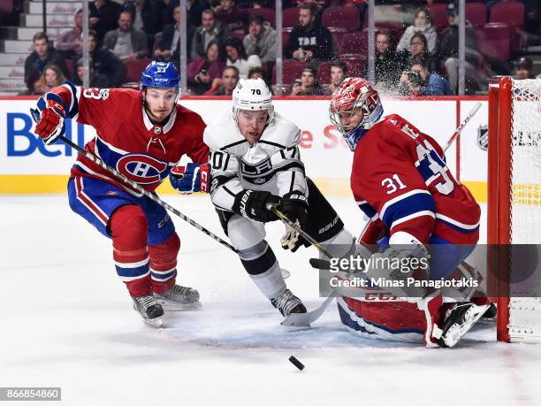 Goaltender Carey Price defends his net as Victor Mete of the Montreal Canadiens and Tanner Pearson of the Los Angeles Kings go after the puck during...