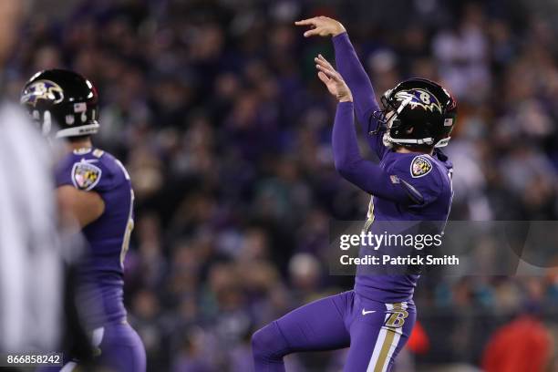 Kicker Justin Tucker of the Baltimore Ravens celebrates after kicking a field goal in the second quarter against the Miami Dolphins at M&T Bank...