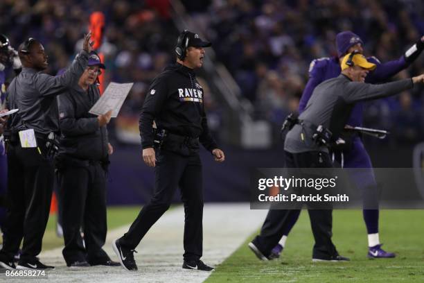 Head Coach John Harbaugh of the Baltimore Ravens reacts after a play in the second quarter against the Miami Dolphins at M&T Bank Stadium on October...