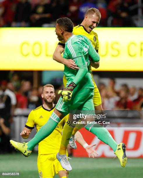 Adam Jahn of Columbus Crew reacts with goalkeeper Zack Steffen after converting a penalty kick to give the Crew a win over the Atlanta United 3-1 on...