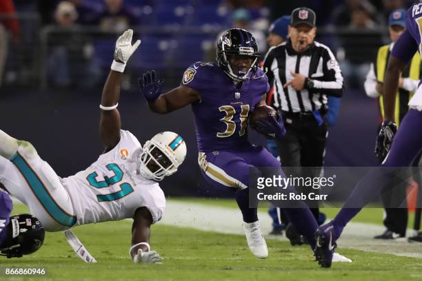 Running Back Bobby Rainey of the Baltimore Ravens carries the ball in the second quarter Miami Dolphins at M&T Bank Stadium on October 26, 2017 in...