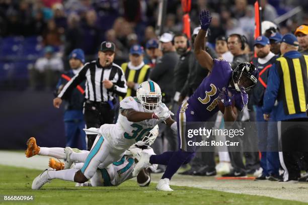 Running Back Bobby Rainey of the Baltimore Ravens carries the ball in the second quarter Miami Dolphins at M&T Bank Stadium on October 26, 2017 in...