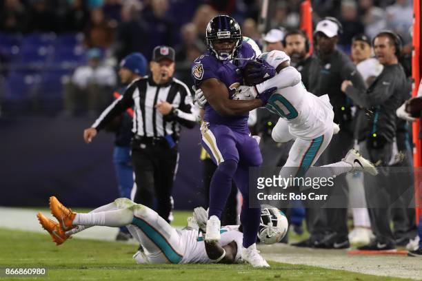 Running Back Bobby Rainey of the Baltimore Ravens carries the ball in the second quarter Miami Dolphins at M&T Bank Stadium on October 26, 2017 in...