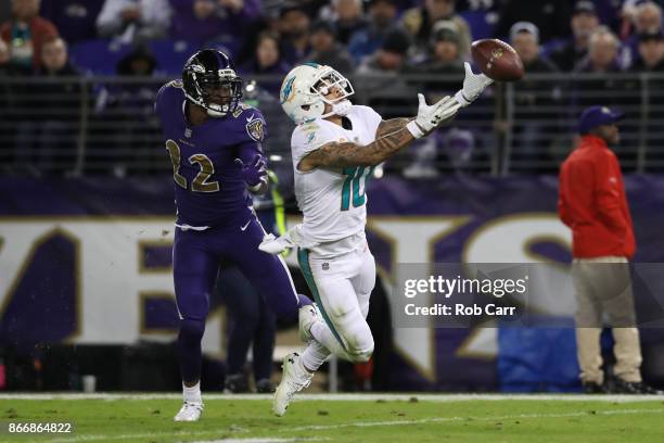 Wide Receiver Kenny Stills of the Miami Dolphins misses a catch in the fourth quarter against the Baltimore Ravens at M&T Bank Stadium on October 26,...