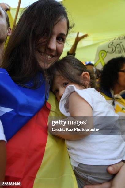 Protesters gather in the city centre to demonstrate against the Spanish federal government's move to suspend Catalonian autonomy on October 21, 2017...