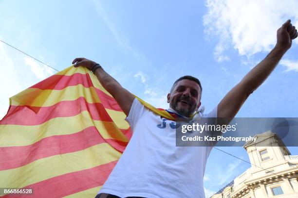 Protesters gather in the city centre to demonstrate against the Spanish federal government's move to suspend Catalonian autonomy on October 21, 2017...