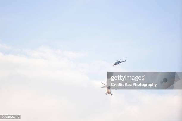 Police helicopters hover as protesters gather in the city centre to demonstrate against the Spanish federal government's move to suspend Catalonian...