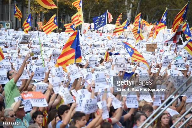 Protesters gather in the city centre to demonstrate against the Spanish federal government's move to suspend Catalonian autonomy on October 21, 2017...