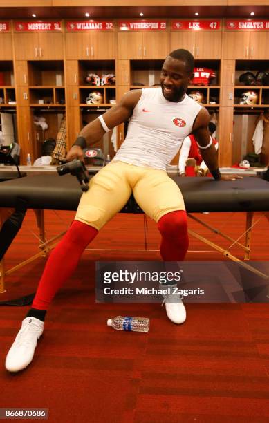 Pierre Garcon of the San Francisco 49ers massages his muscles in the locker room prior to the game against the Dallas Cowboys at Levi's Stadium on...