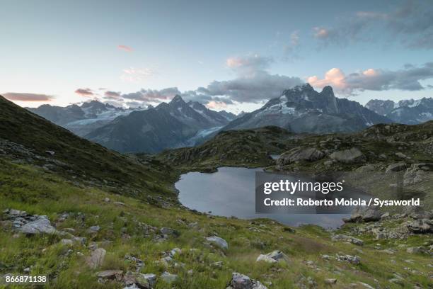 mont blanc massif seen from lacs de cheserys, france - lake chesery stockfoto's en -beelden