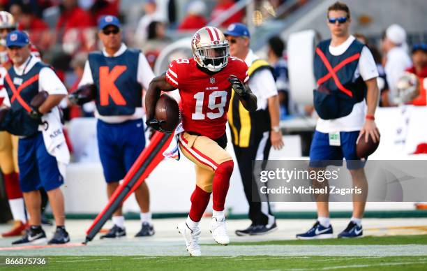 Aldrick Robinson of the San Francisco 49ers runs after making a reception during the game against the Dallas Cowboys at Levi's Stadium on October 22,...