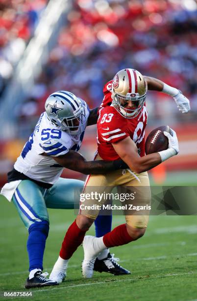 Cole Hikutini of the San Francisco 49ers gets tackled after making a reception during the game against the Dallas Cowboys at Levi's Stadium on...