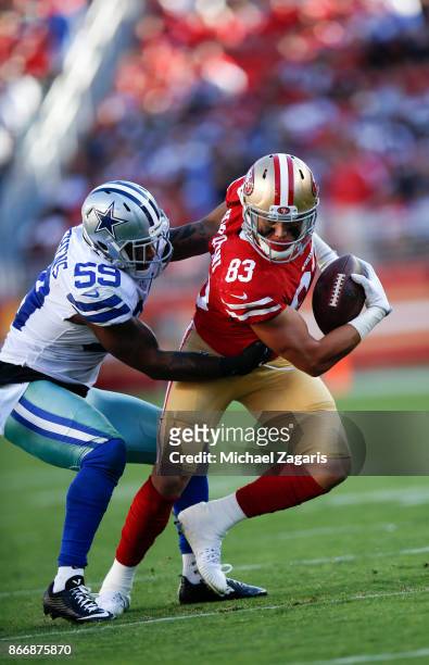 Cole Hikutini of the San Francisco 49ers gets tackled after making a reception during the game against the Dallas Cowboys at Levi's Stadium on...