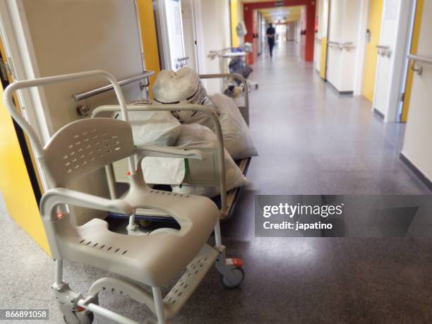 medical utensils in the hallway of a hospital - trash bag dress stock pictures, royalty-free photos & images