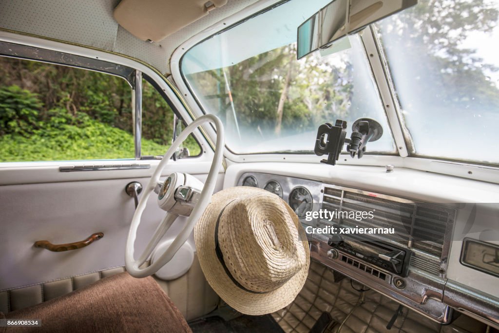 Cuban hat inside a vintage car in Cuba