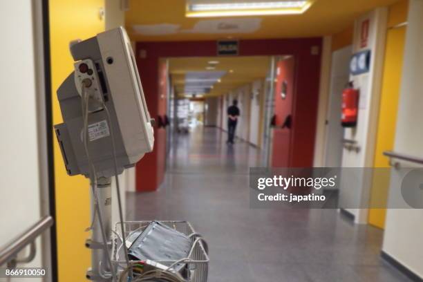 medical equipment in the corridors of a hospital - hospital cart stock pictures, royalty-free photos & images