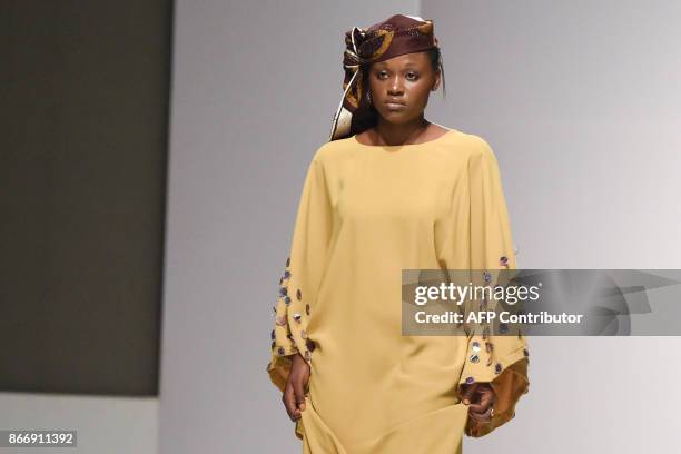 Model presents a creation by House of Kaya during the Lagos Fashion and Design Week, on October 25, 2017. Ibrahim Aminu's House of Kaya, so far is...