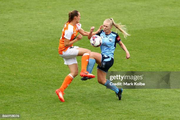 Abbey Lloyd of the Roar and Elizabeth Ralston of Sydney FC collide as they compete for the ball during the round one W-League match between Sydney FC...