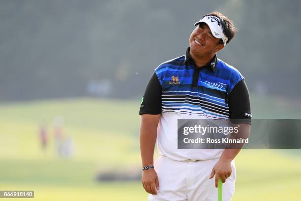 Kiradech Aphibarnrat of Thailand reacts on the 18th green during the second round of the WGC - HSBC Champions at Sheshan International Golf Club on...