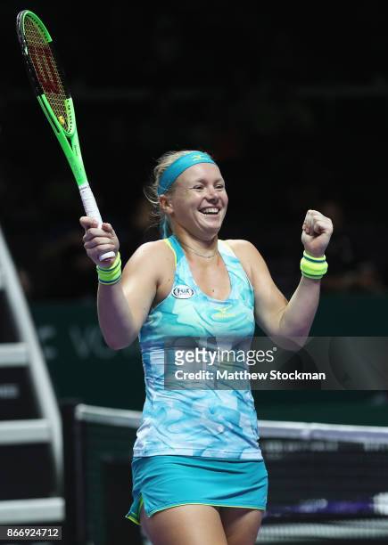 Kiki Bertens of Netherlands, partnering Johanna Larsson of Sweden celebrates victory in their doubles match against Casey Dellacqua and Ashleigh...
