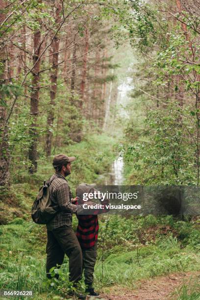 family time together in nature - children bird watching stock pictures, royalty-free photos & images