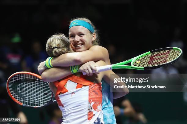 Kiki Bertens of Netherlands and Johanna Larsson of Sweden celebrate victory in their doubles match against Casey Dellacqua and Ashleigh Barty of...