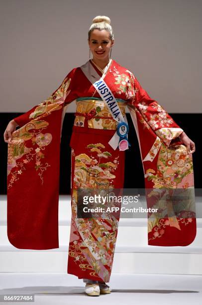 Miss Australia, Amber Dew poses in a traditonal Japanese Kimono during the 57th Miss International Beauty Pageant press conference in Tokyo on...