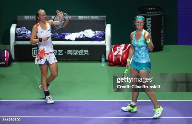 Kiki Bertens of Netherlands and Johanna Larsson of Sweden celebrate victory in their doubles match against Casey Dellacqua and Ashleigh Barty of...