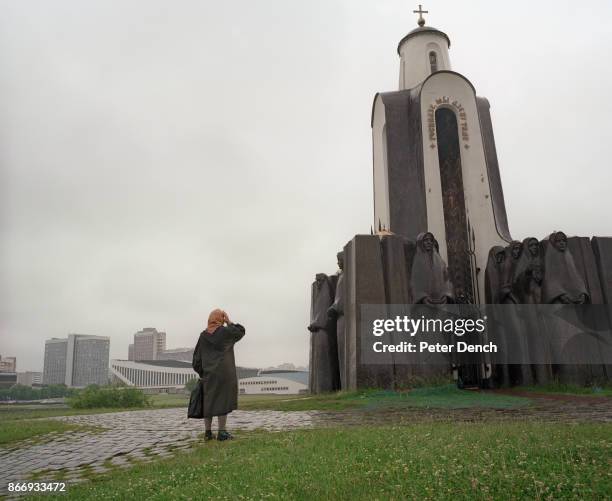 An elderly woman pays her respects on Victory Day at The Isle of Tears, a monument dedicated to the soldiers who perished in the nine-year conflict...