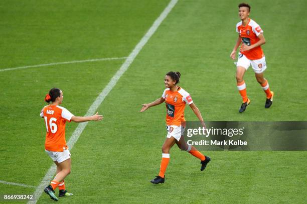 Allira Toby of the Roar celebrates with her team mates Hayley Raso and Wai Ki Cheung of the Roar after scoring a goal during the round one W-League...