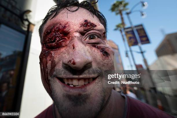 Animal rights activist dressed as a zombie during a Halloween campaign against meat consumption in Los Angeles, California on October 26, 2017....