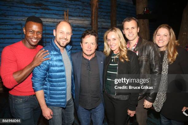 Michael J Fox and Tracy Pollan pose backstage with the cast of the hit musical "Come From Away" on Broadway at The Gerald Schoenfeld Theatre on...