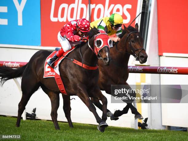 Dean Yendall riding Black Sheep defeats Luke Currie riding Fox Hall in Race 3, during Manikato Stakes Night at Moonee Valley Racecourse on October...