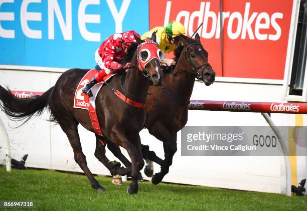 Dean Yendall riding Black Sheep defeats Luke Currie riding Fox Hall in Race 3, during Manikato Stakes Night at Moonee Valley Racecourse on October...