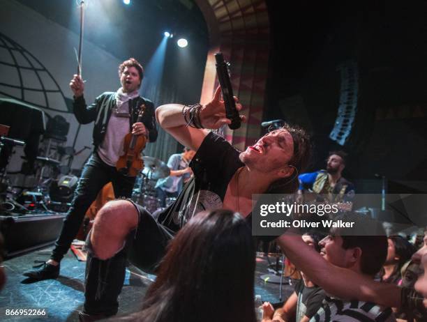 Zambricki Li, Austin Bisnow, and Brian Zaghi of Magic Giant perform at the Regent Theater on October 26, 2017 in Los Angeles, California.