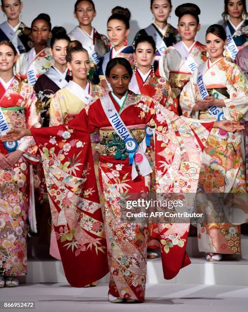 Miss Tunisia, Khaoula Gueye poses in traditional Japanese Kimono during the 57th Miss International Beauty Pageant press conference in Tokyo on...