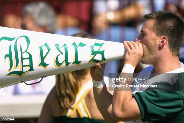Baylor Bears cheerleader yells through a megaphone before the Big 12 Conference football game against the Oklahoma Sooners on October 20, 2001 at...