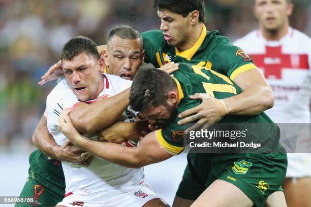Ryan Hall of England gets tackled by Will Chambers Jordan McLean and Matt Gillett of the Kangaroos during the 2017 Rugby League World Cup match...