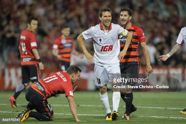 Isaias Sanchez Cortes of the Adelaide United give away a penalty after falling over Wanderers Brendon Santalab during the Semi Final FFA Cup match...