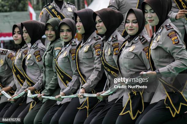 Indonesian women's police officers and women's soldiers took part on a perform traditional dance a Tarek Pukat at Alue Dua Village, North Aceh...