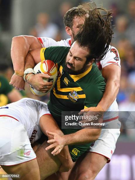 Aaron Woods of Australia is tackled during the 2017 Rugby League World Cup match between the Australian Kangaroos and England at AAMI Park on October...