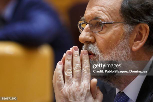 Spain's Prime Minister Mariano Rajoy gestures during a plenary session to approve article 155 of the Spanish Constitution at the Spanish Senate on...