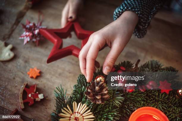kids decorating advent wreath - christmas advent wreath stock pictures, royalty-free photos & images
