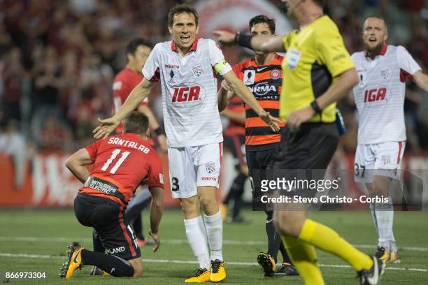 Isaias Sanchez Cortes of the Adelaide United give away a penalty after falling over Wanderers Brendon Santalab during the Semi Final FFA Cup match...