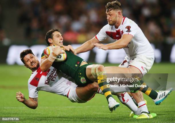 Billy Slater of the Kangaroos is tackled by Gareth Widdop of England during the 2017 Rugby League World Cup match between the Australian Kangaroos...