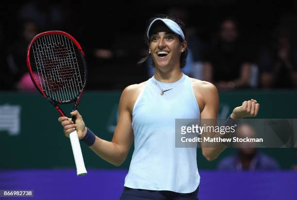 Caroline Garcia of France celebrates victory in her singles match against Caroline Wozniacki of Denmark during day 6 of the BNP Paribas WTA Finals...