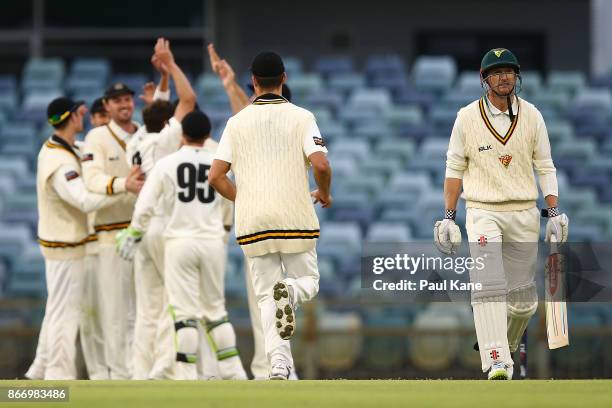 George Bailey of the Tigers walks back to the rooms after being dismissed by Jhye Richardson of Western Australia during day two of the Sheffield...