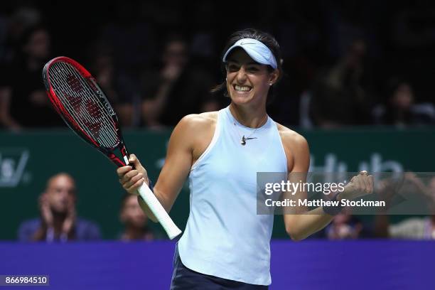 Caroline Garcia of France celebrates victory in her singles match against Caroline Wozniacki of Denmark during day 6 of the BNP Paribas WTA Finals...