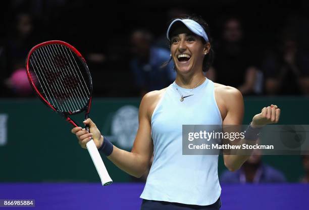 Caroline Garcia of France celebrates victory in her singles match against Caroline Wozniacki of Denmark during day 6 of the BNP Paribas WTA Finals...