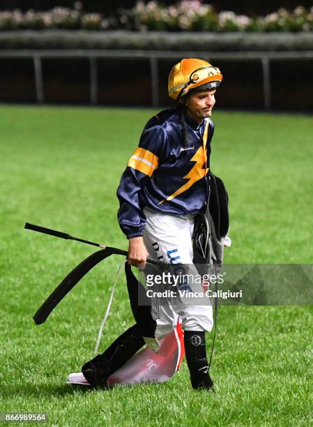 Dwayne Dunn walks off the track after Chautauqua was scratched at the barrier in Race 7, Ladbrokes Manikato Stakes during Manikato Stakes Night at...